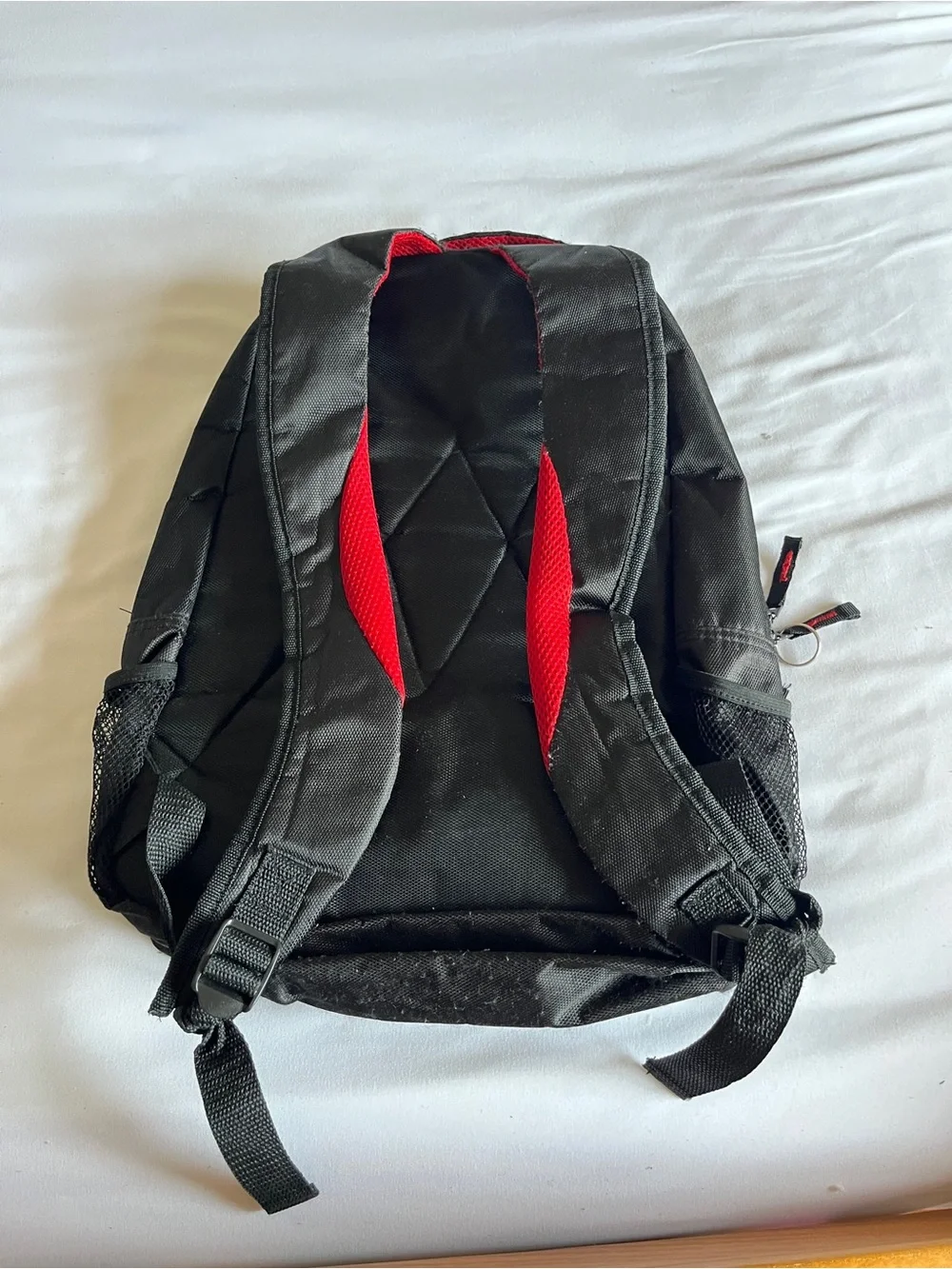 Black & Red Multi-Pocket Backpack with Media Port & Mesh Side Pockets